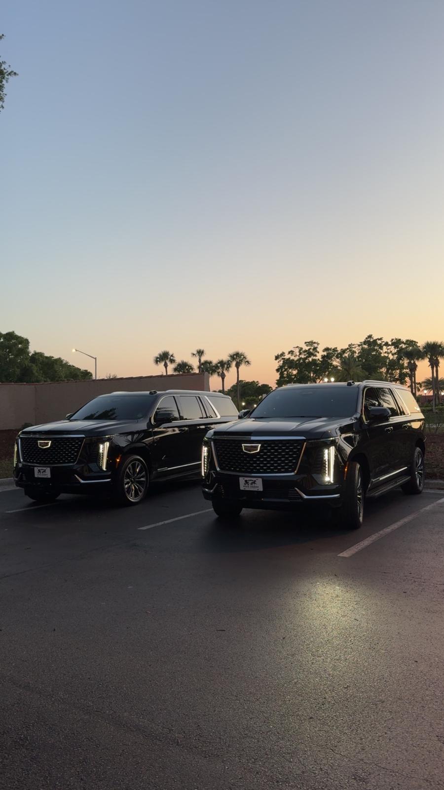 Black Cadillac Escalade SUVs at sunset for an Orlando wedding
