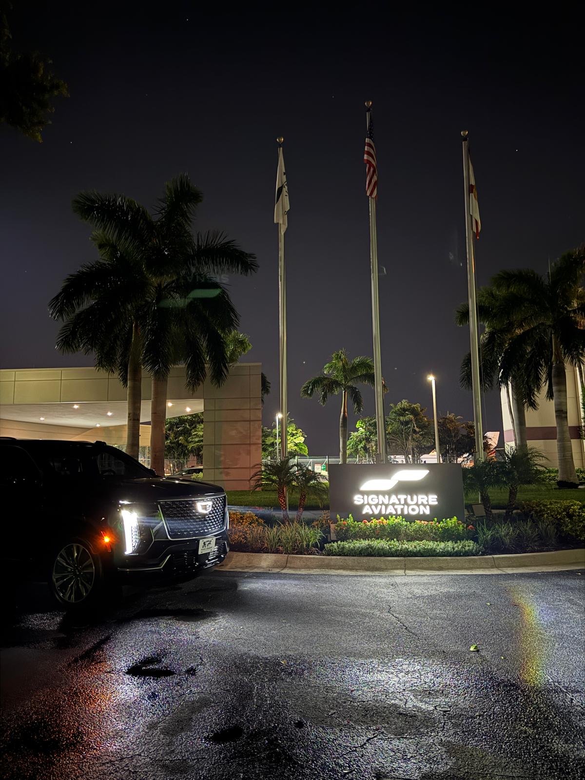 Black Cadillac Escalade at an Orlando resort with palms for a special occasion
