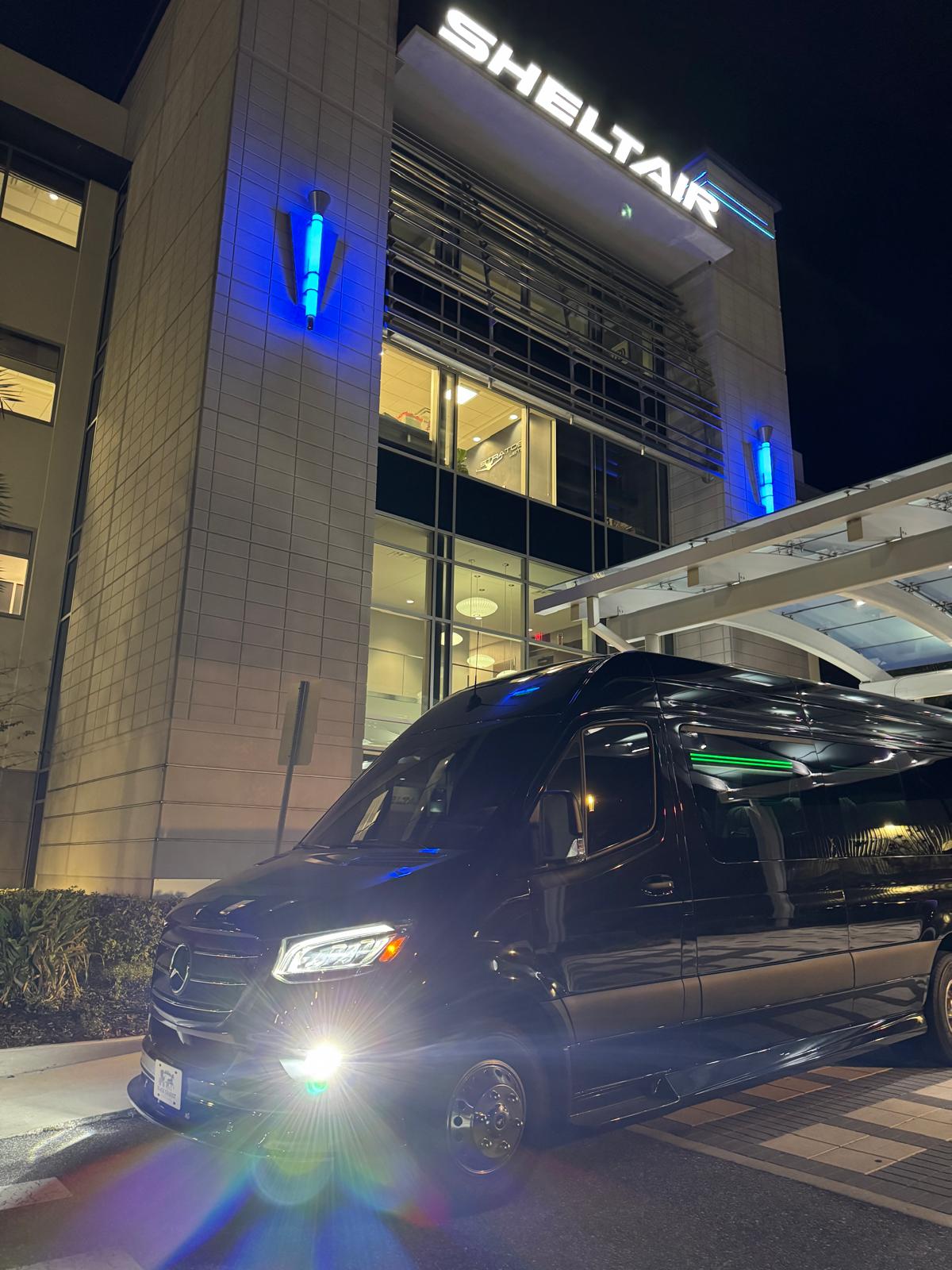 Black Cadillac Escalade at an Orlando venue at night for a night out