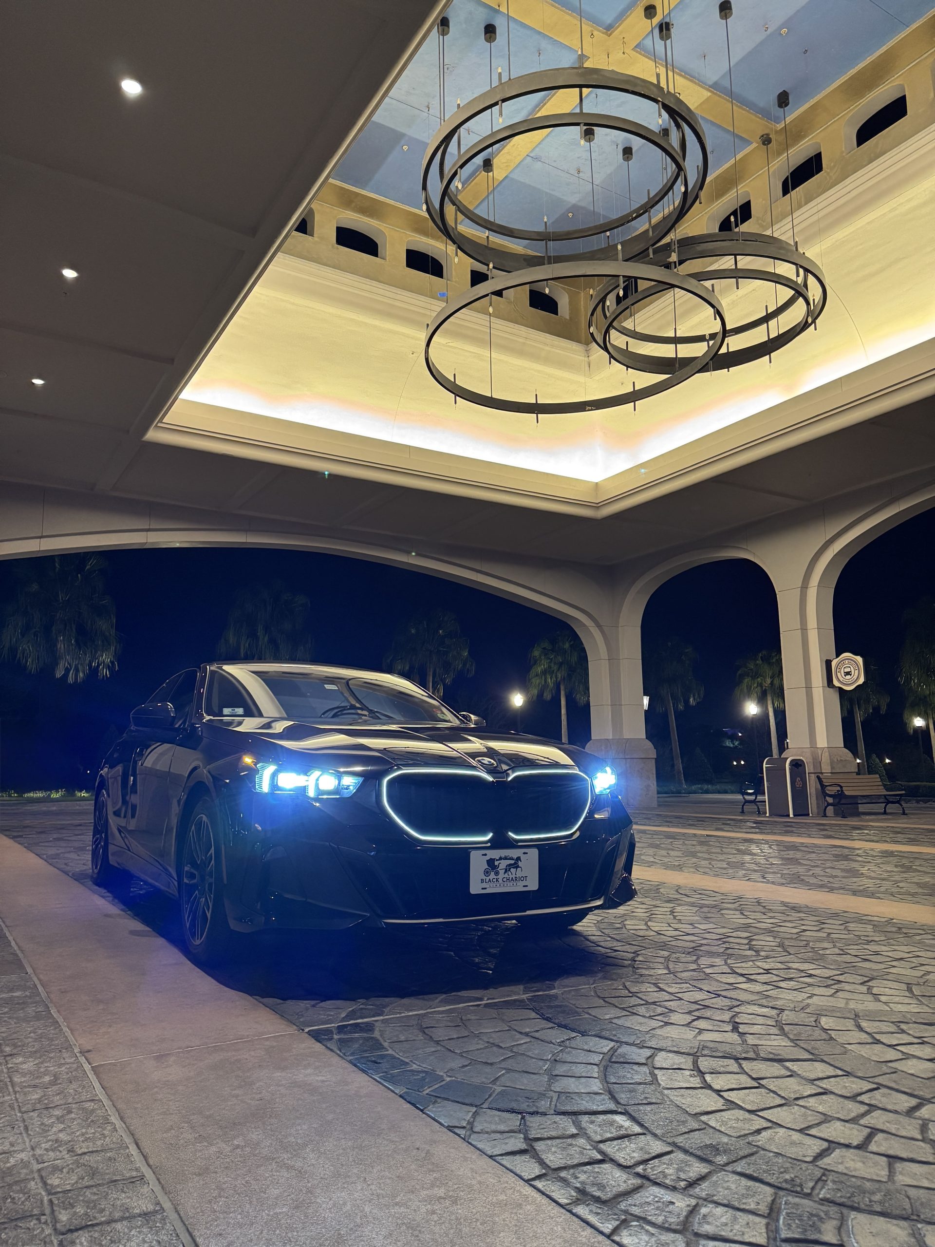 Black Cadillac Escalade under an elegant resort porte-cochere for an Orlando wedding